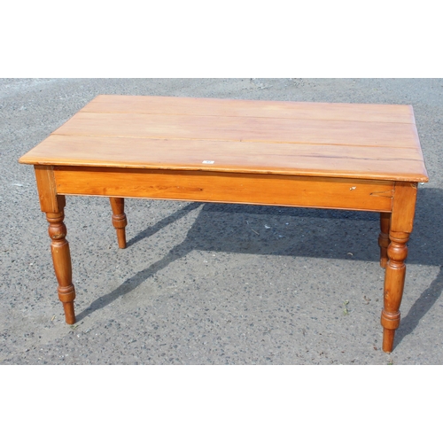 62 - A vintage pine farmhouse table with 3 plank top and turned legs, approx 143cm wide x 85cm deep x 75c... 