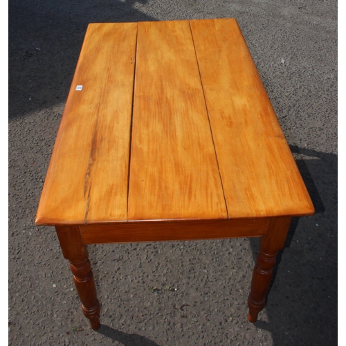 62 - A vintage pine farmhouse table with 3 plank top and turned legs, approx 143cm wide x 85cm deep x 75c... 