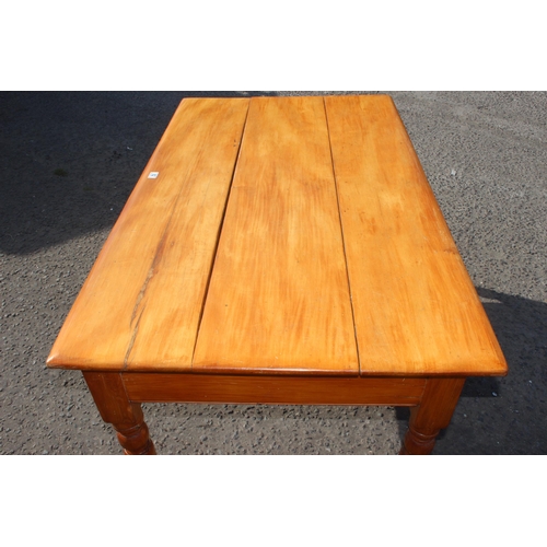 62 - A vintage pine farmhouse table with 3 plank top and turned legs, approx 143cm wide x 85cm deep x 75c... 