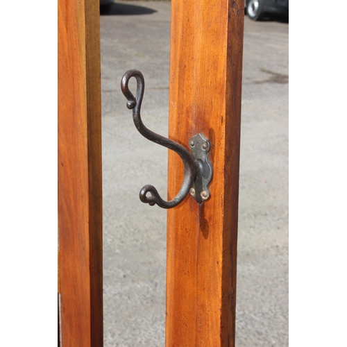 63 - A vintage oak hall stand with mirror, coat hooks and stick/ umbrella stand, approx 76cm wide x 29cm ... 