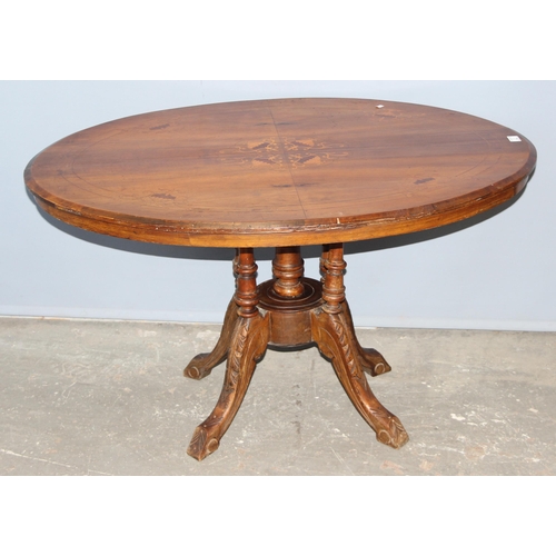 7 - An Edwardian oval tilt top table with marquetry inlay, approx 116cm wide x 86cm deep x 70cm tall