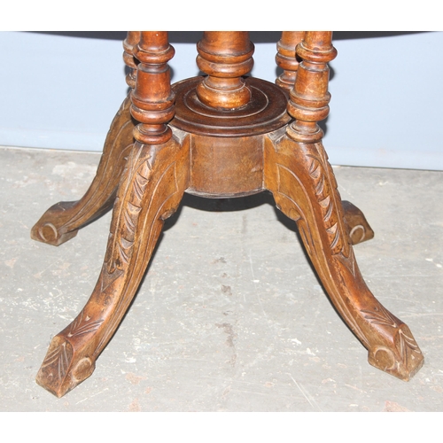 7 - An Edwardian oval tilt top table with marquetry inlay, approx 116cm wide x 86cm deep x 70cm tall