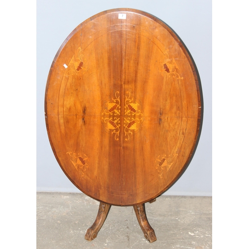 7 - An Edwardian oval tilt top table with marquetry inlay, approx 116cm wide x 86cm deep x 70cm tall