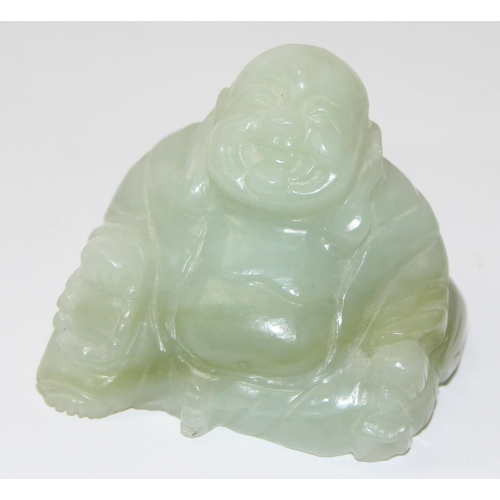 1607 - A small Chinese jade carving of a seated Buddha with beads, approx 55mm wide x 50mm tall