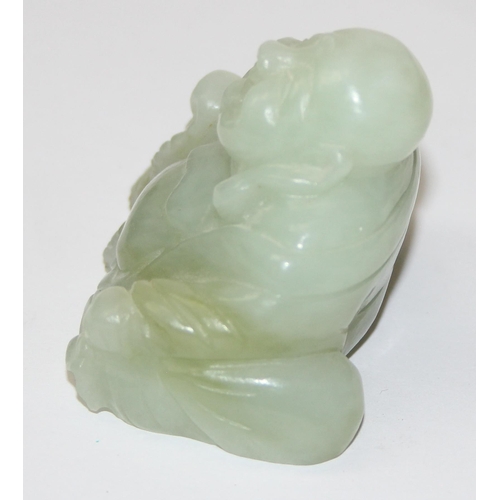 1607 - A small Chinese jade carving of a seated Buddha with beads, approx 55mm wide x 50mm tall