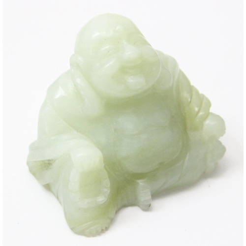 1607 - A small Chinese jade carving of a seated Buddha with beads, approx 55mm wide x 50mm tall