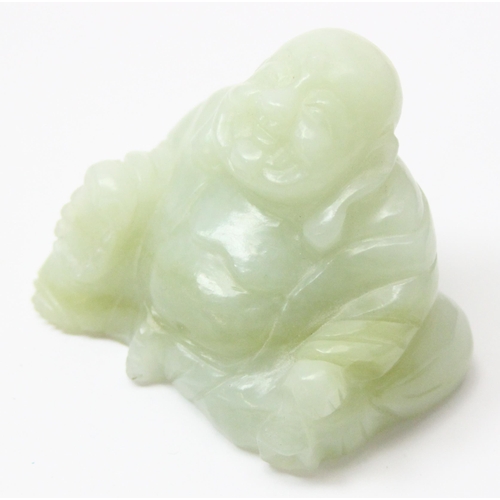 1607 - A small Chinese jade carving of a seated Buddha with beads, approx 55mm wide x 50mm tall