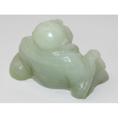 1607 - A small Chinese jade carving of a seated Buddha with beads, approx 55mm wide x 50mm tall