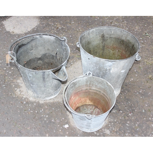 312 - 3 vintage galvanised buckets, one with spout, more check for marks and writing, pics of it