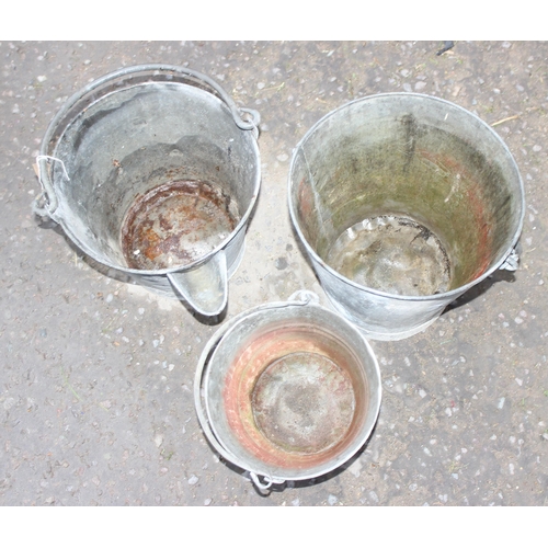 312 - 3 vintage galvanised buckets, one with spout, more check for marks and writing, pics of it