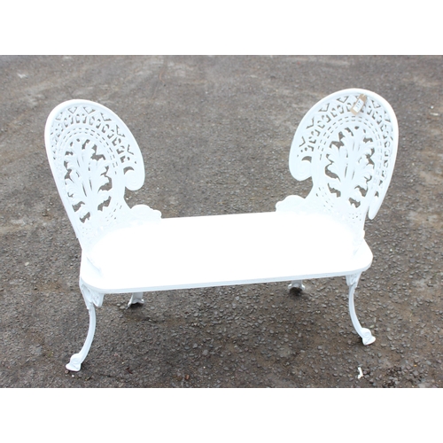 317 - An unusual home made white painted 2 seater garden bench with cast irons backs and legs and a wooden... 