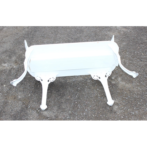 317 - An unusual home made white painted 2 seater garden bench with cast irons backs and legs and a wooden... 