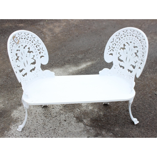 318 - An unusual home made white painted 2 seater garden bench with cast irons backs and legs and a wooden... 