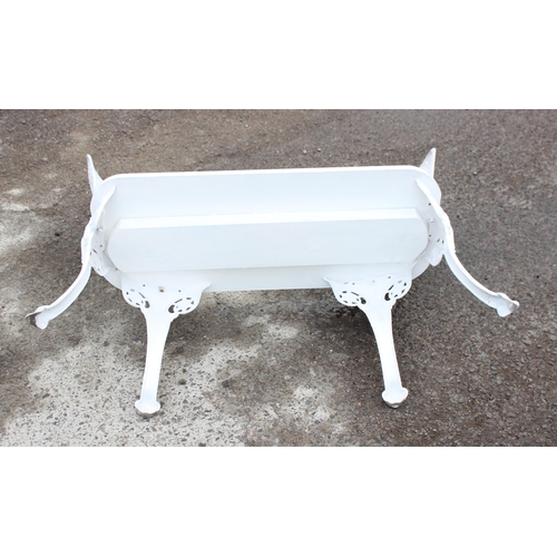 318 - An unusual home made white painted 2 seater garden bench with cast irons backs and legs and a wooden... 