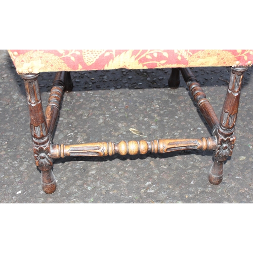 76 - A Carolean style carved oak hall chair with upholstered seat and back, likely 19th century