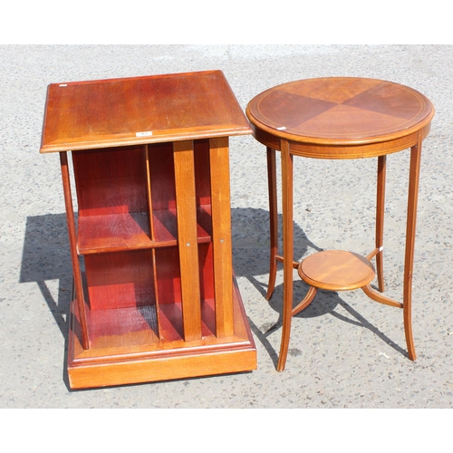 82 - A 20th century mahogany revolving bookcase and a Sheraton Revival round table (2)