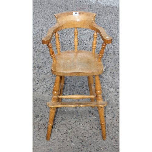 87 - A vintage beech child's high chair, smoker's bowl form, approx 80cm tall