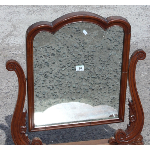 88 - An antique mahogany framed table top mirror with carved details, approx 69cm wide x 82cm tall