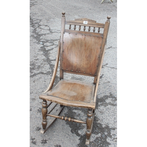 103 - An Art Nouveau period wooden rocking chair with bentwood seat and back