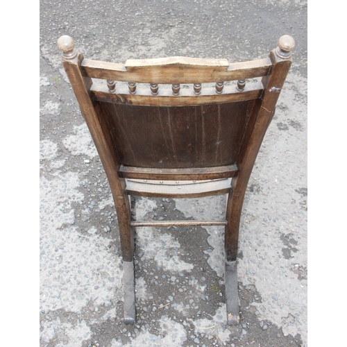 103 - An Art Nouveau period wooden rocking chair with bentwood seat and back