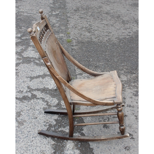 103 - An Art Nouveau period wooden rocking chair with bentwood seat and back