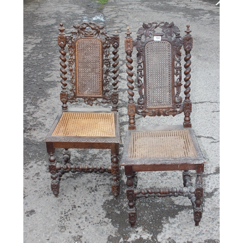 104 - A pair of Carolean style oak hall chairs with Bergere seats and barleytwist supports