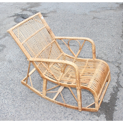 117 - A retro bamboo and wicker rocking chair