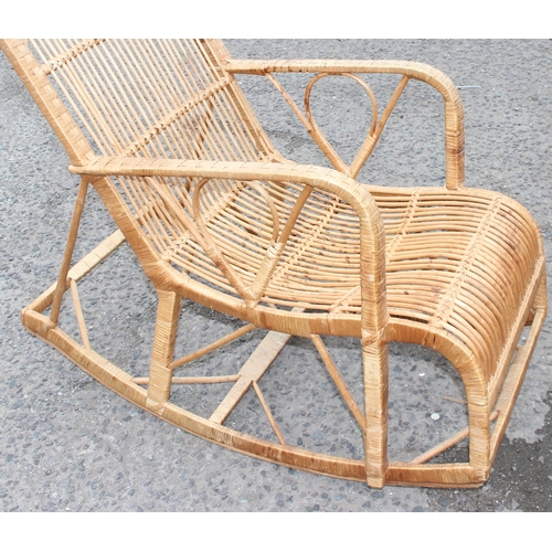 117 - A retro bamboo and wicker rocking chair