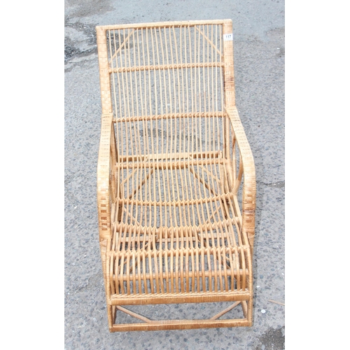 117 - A retro bamboo and wicker rocking chair