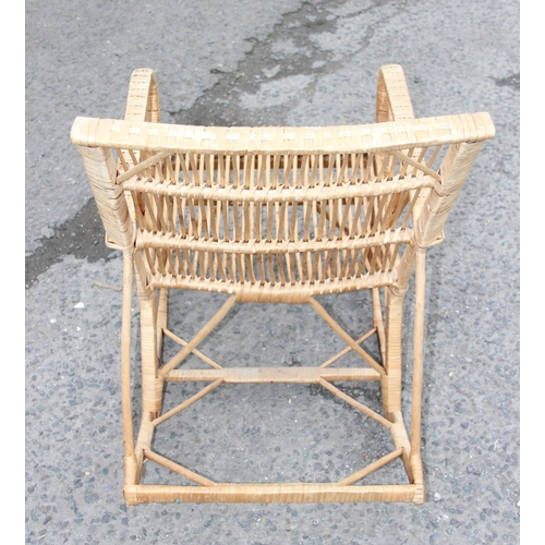 117 - A retro bamboo and wicker rocking chair