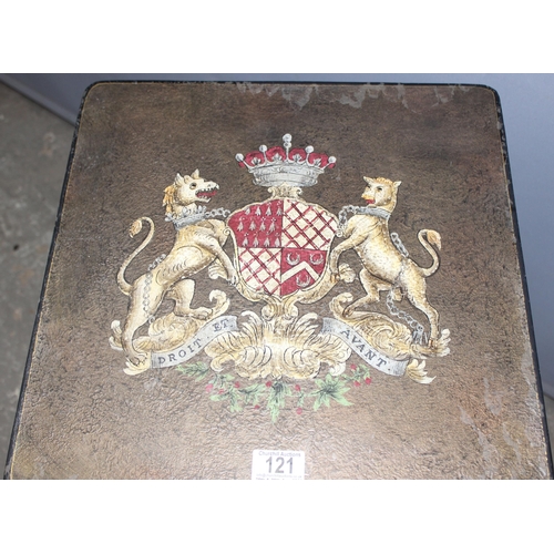 121 - A vintage style metal folding table with armorial crest