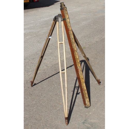 3 - A vintage E.R. Watts & Son wooden and metal tripod and a mahogany cased surveyor's measuring pole