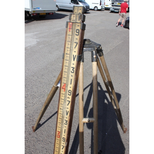 3 - A vintage E.R. Watts & Son wooden and metal tripod and a mahogany cased surveyor's measuring pole