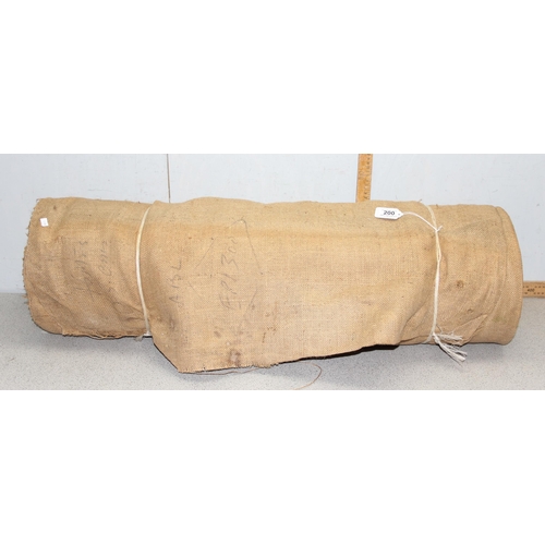 200 - A large roll of vintage upholstery hessian