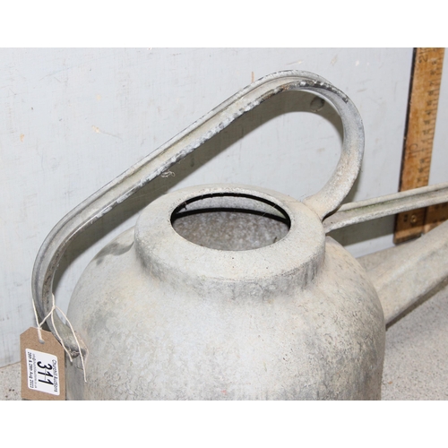 311 - An unusual vintage galvanised watering can