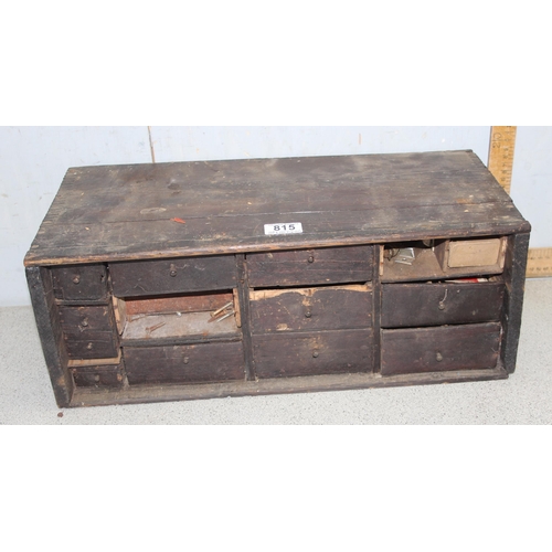 815 - A vintage wooden multi-drawer chest with content, approx 51cm wide x 24cm deep x 18cm tall