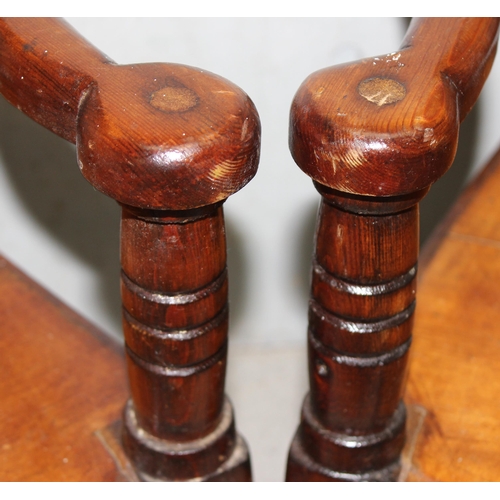 145 - Pair of vintage pitch pine children’s chairs with shaped back rest and unusual arms