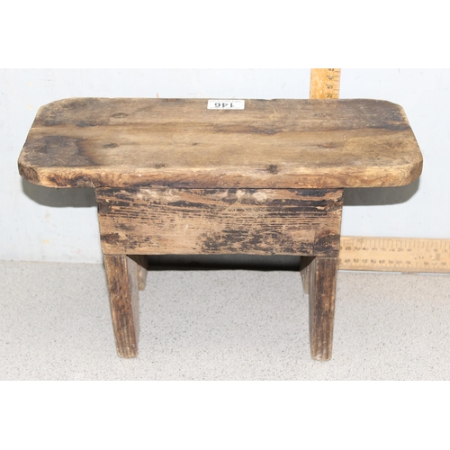 146 - A small rustic pine milking stool, approx 38cm wide