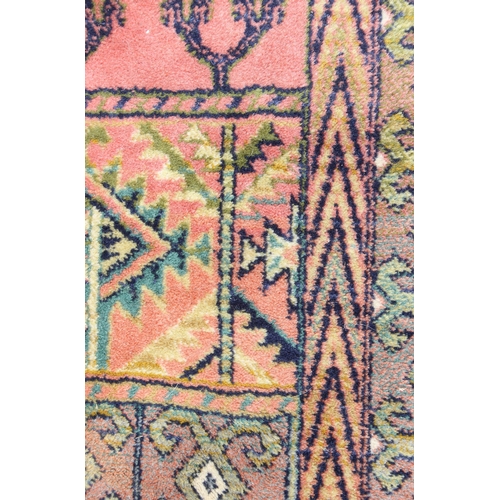 208 - A vintage Hadchlou wool rug, with labels, approx 230cm x 158cm