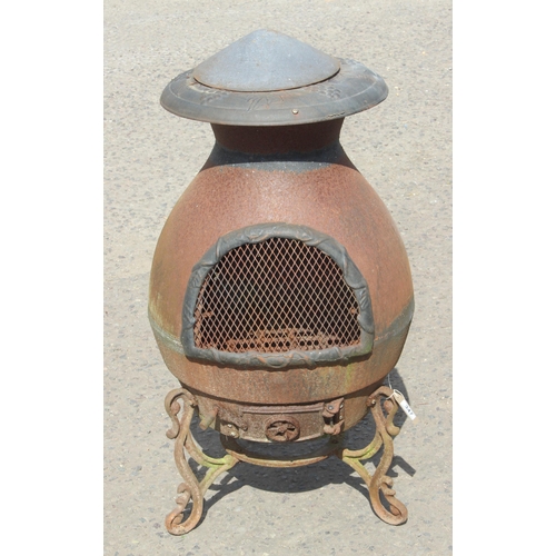 347 - A weathered metal garden chimenea or brazier