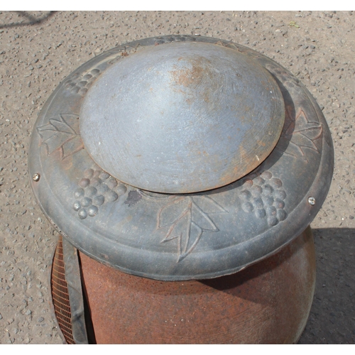 347 - A weathered metal garden chimenea or brazier