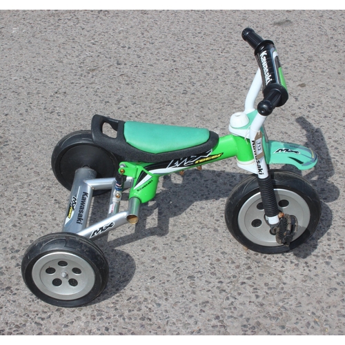 712 - Childs Kawasaki welded steel framed tricycle with rear suspension mechanism and 10 inch rubber wheel... 