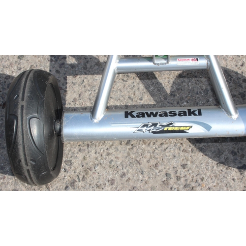 712 - Childs Kawasaki welded steel framed tricycle with rear suspension mechanism and 10 inch rubber wheel... 