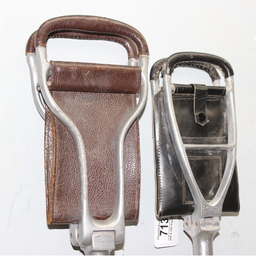 713 - Two vintage adjustable height shooting sticks with leather seating