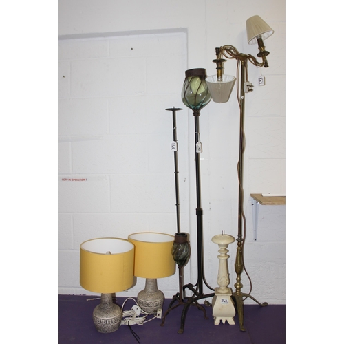 242 - 3 wrought iron candle holders, largest approx 127cm tall, a brass floor standing double lamp with sh... 