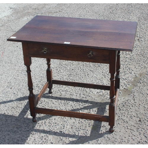 124 - An antique oak console table with single drawer and turned legs, approx 87cm wide x 61cm deep x 72cm... 