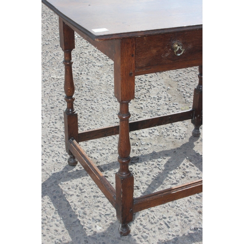 124 - An antique oak console table with single drawer and turned legs, approx 87cm wide x 61cm deep x 72cm... 