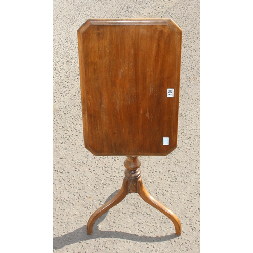 130 - A small antique mahogany tilt top table with tripod base, approx 62cm wide x 41cm deep x 77cm tall