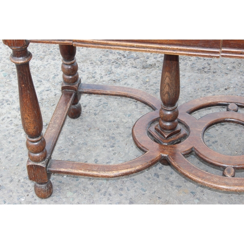 142 - A 17th century style oak side table with 2 main drawers and smaller middle hidden drawer. An unusual... 