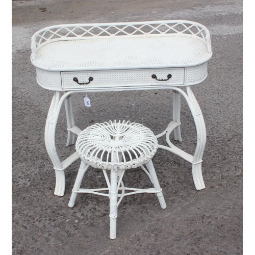 143 - A retro white painted bamboo and rattan desk with drawer and a white painted bamboo stool likely by ... 